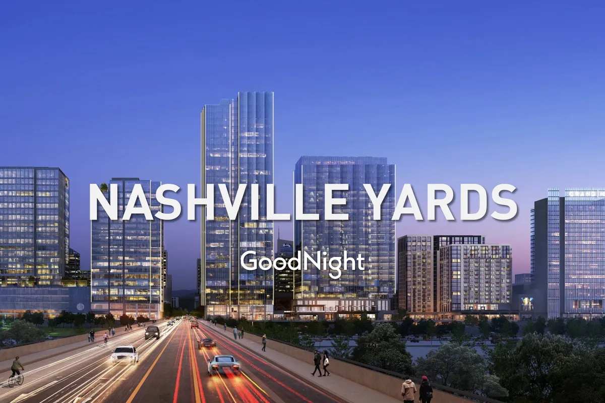 A panoramic view of Nashville's illuminated skyline and busy roadways at night. The bright city lights and bustling streets capture the essence of an energetic urban core.