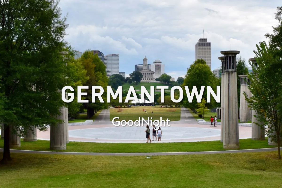 A view of a central city park with lush green lawns, people walking and gathering in groups, and the city skyline in the background. The image conveys a laid-back, family-friendly atmosphere, perfect for outdoor play and picnics.